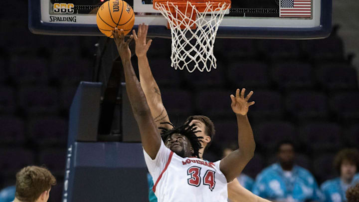Hosana Kitenge (34) shoots during the Coastal Carolina University vs University of Louisiana at Lafayette basketball game in the second round of the Sun Belt Conference Men's Basketball Championship at the Pensacola Bay Center on Thursday, March 7, 2024.