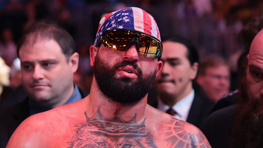 Apr 11, 2026; Miami, Florida, UNITED STATES; Josh Hokit (blue gloves) reacts after the fight against Curtis Blaydes (red gloves) during UFC 327 at Kaseya Center. Mandatory Credit: Sam Navarro-Imagn Images