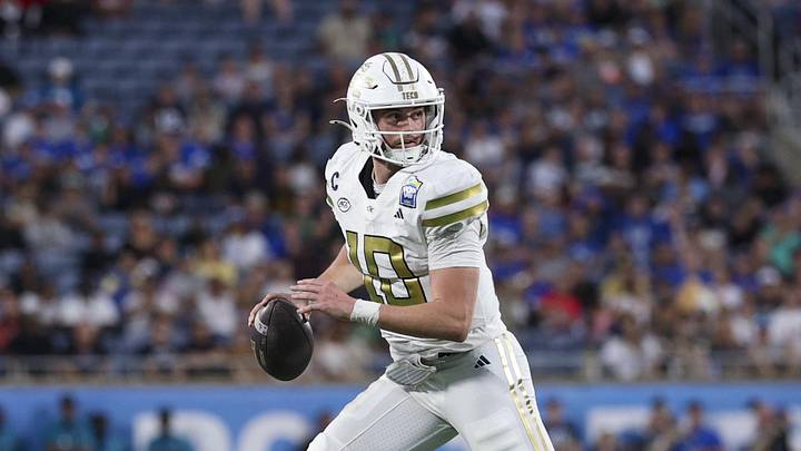 Dec 27, 2025; Orlando, FL, USA; Georgia Tech Yellow Jackets quarterback Haynes King (10) looks to pass against the BYU Cougars in the third quarter during the Pop-Tarts Bowl at Camping World Stadium. Mandatory Credit: Nathan Ray Seebeck-Imagn Images