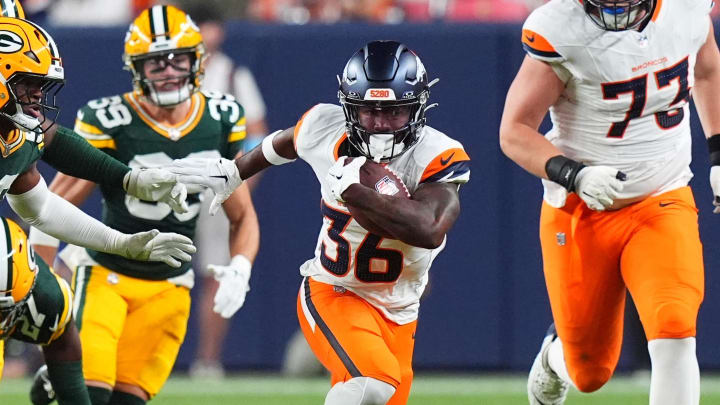 Aug 18, 2024; Denver, Colorado, USA; Denver Broncos running back Tyler Badie (36) carries the ball in the third quarter at Empower Field at Mile High. 