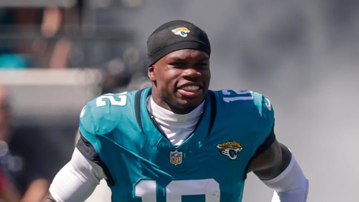Oct 12, 2025; Jacksonville, Florida, USA;Jacksonville Jaguars player Travis Hunter (12) runs out during team introductions before the game against the Seattle Seahawks at EverBank Stadium. 