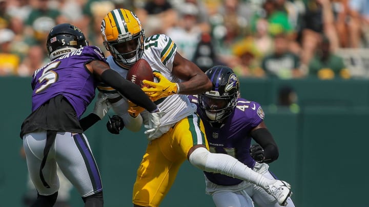 Green Bay Packers wide receiver Malik Heath (18) catches a pass against the Baltimore Ravens on Saturday.