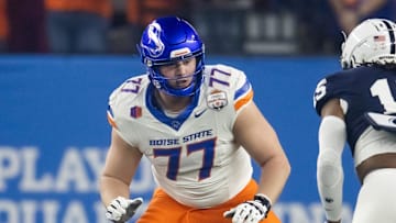 Dec 31, 2024; Glendale, AZ, USA; Boise State Broncos offensive tackle Kage Casey (77) against the Penn State Nittany Lions during the Fiesta Bowl at State Farm Stadium. Mandatory Credit: Mark J. Rebilas-Imagn Images