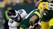 Philadelphia Eagles linebacker Jalyx Hunt (58) sacks Green Bay Packers quarterback Jordan Love (10) in the first quarter during their football game Monday, November 10, 2025, at Lambeau Field in Green Bay, Wisconsin.