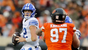 Jake Retzlaff scans the field against Oklahoma State in last season's finale