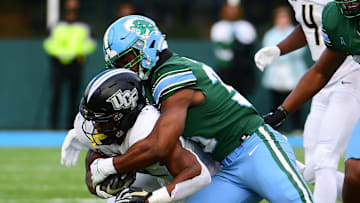 Nov 12, 2022; New Orleans, Louisiana, USA; Tulane Green Wave linebacker Jesus Machado (35) tackles UCF Knights running back RJ Harvey (22) during the second quarter at Yulman Stadium.