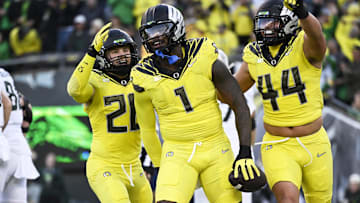 Oct 4, 2024; Eugene, Oregon, USA; Oregon Ducks defensive end Jordan Burch (1) celebrates with teammates linebacker Bryce Boettcher (28) and linebacker Teitum Tuioti (44) after recovering a fumble for a safety during the first half against the Michigan State Spartans at Autzen Stadium. Mandatory Credit: Troy Wayrynen-Imagn Images