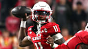 Nov 1, 2025; Raleigh, North Carolina, USA;  North Carolina State Wolfpack quarterback CJ Bailey (11) throws a pass during the first quarter against the Georgia Tech Yellow Jackets at Carter-Finley Stadium. Mandatory Credit: Zachary Taft-Imagn Images