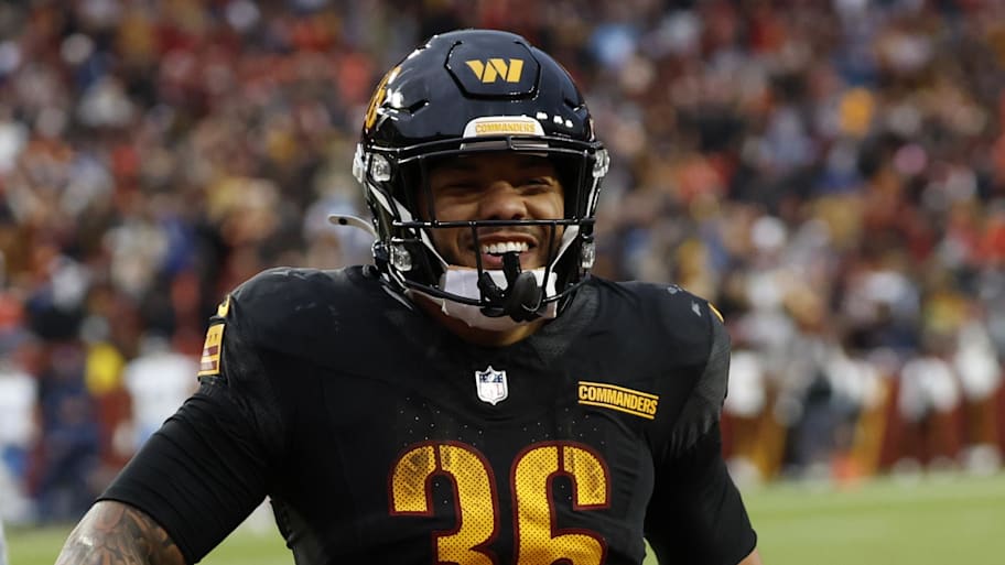 Washington Commanders running back Chris Rodriguez Jr. celebrates after scoring a touchdown. | Geoff Burke-Imagn Images