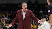 Arkansas Razorbacks coach John Calipari argues with an official during a break in play against the Baylor Bears during the first half at American Airlines Center.