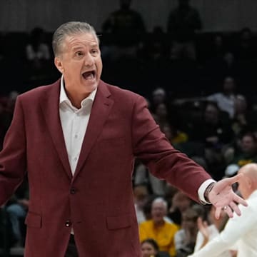 Arkansas Razorbacks coach John Calipari argues with an official during a break in play against the Baylor Bears during the first half at American Airlines Center.