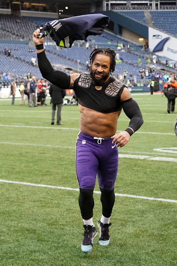 Baltimore Ravens safety Earl Thomas waves the jersey of Seattle Seahawks quarterback Russell Wilson