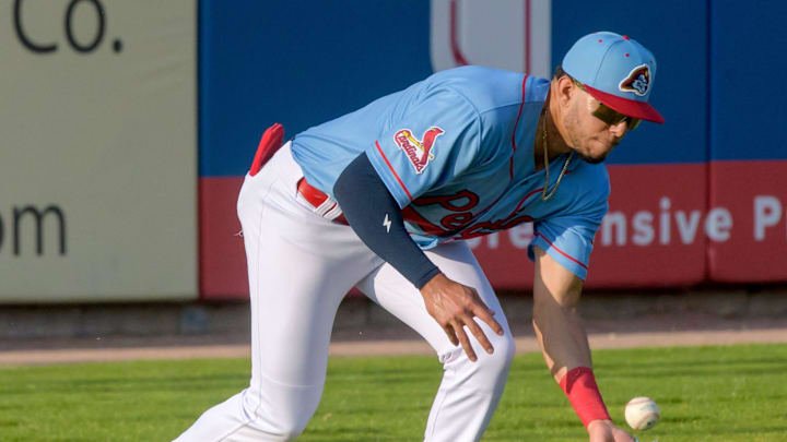 Peoria Chiefs outfielder Joshua Baez fields a hit to left field during a game against the Michigan Whitecaps on Wednesday, May 15, 2024 at Dozer Park in Peoria.