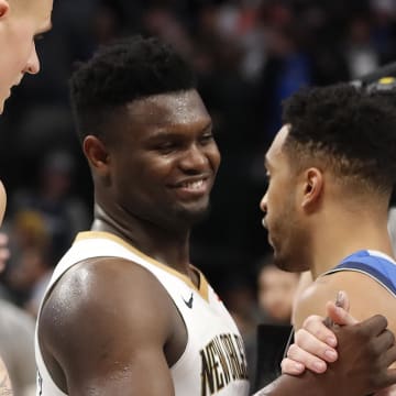 Mar 4, 2020; Dallas, Texas, USA;  Dallas Mavericks guard Luka Doncic (77) shakes hands with New Orleans Pelicans forward Zion Williamson (1) after the game at American Airlines Center. Mandatory Credit: Kevin Jairaj-USA TODAY Sports