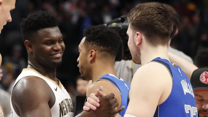 Mar 4, 2020; Dallas, Texas, USA;  Dallas Mavericks guard Luka Doncic (77) shakes hands with New Orleans Pelicans forward Zion Williamson (1) after the game at American Airlines Center. Mandatory Credit: Kevin Jairaj-USA TODAY Sports