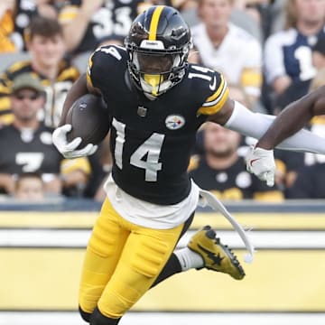 Aug 9, 2024; Pittsburgh, Pennsylvania, USA;  Pittsburgh Steelers wide receiver George Pickens (14) runs past Houston Texans cornerback Kris Boyd (17) after a catch during the first quarter at Acrisure Stadium. Mandatory Credit: Charles LeClaire-USA TODAY Sports