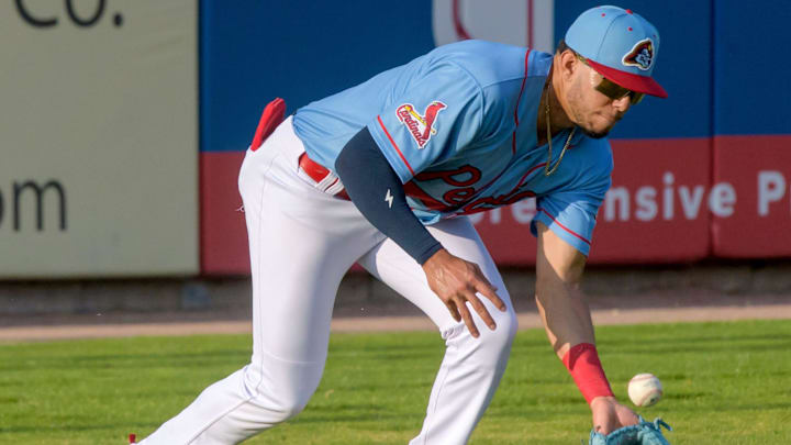 Peoria Chiefs outfielder Joshua Baez fields a hit to left field during a game against the Michigan Whitecaps on Wednesday, May 15, 2024 at Dozer Park in Peoria.