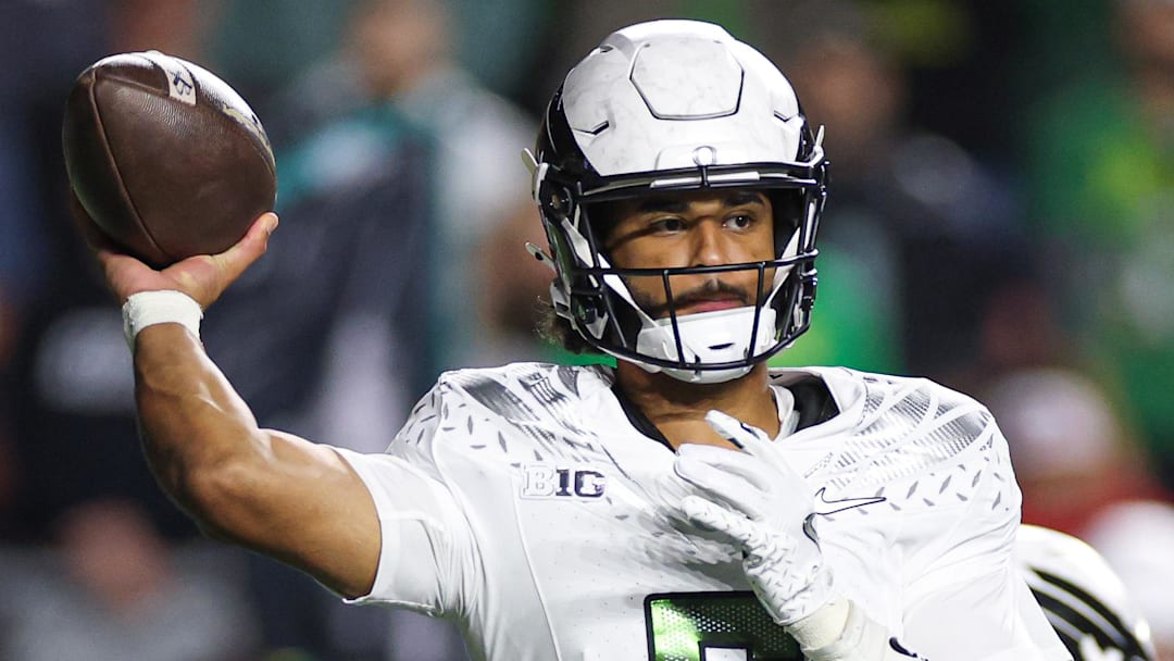 Oct 18, 2025; Piscataway, New Jersey, USA;  Oregon Ducks quarterback Dante Moore (5) throws the ball during the first half against the Rutgers Scarlet Knights at SHI Stadium. Mandatory Credit: Vincent Carchietta-Imagn Images