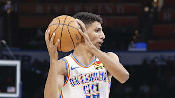 Oct 17, 2024; Oklahoma City, Oklahoma, USA; Oklahoma City Thunder forward Malevy Leons (17) drives to the basket against Atlanta Hawks guard Keaton Wallace (2) during the second half at Paycom Center. Mandatory Credit: Alonzo Adams-Imagn Images