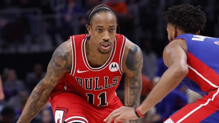 Apr 11, 2024; Detroit, Michigan, USA;  Chicago Bulls forward DeMar DeRozan (11) dribbles defended by Detroit Pistons forward Troy Brown Jr. (7) in the second half at Little Caesars Arena. Mandatory Credit: Rick Osentoski-USA TODAY Sports