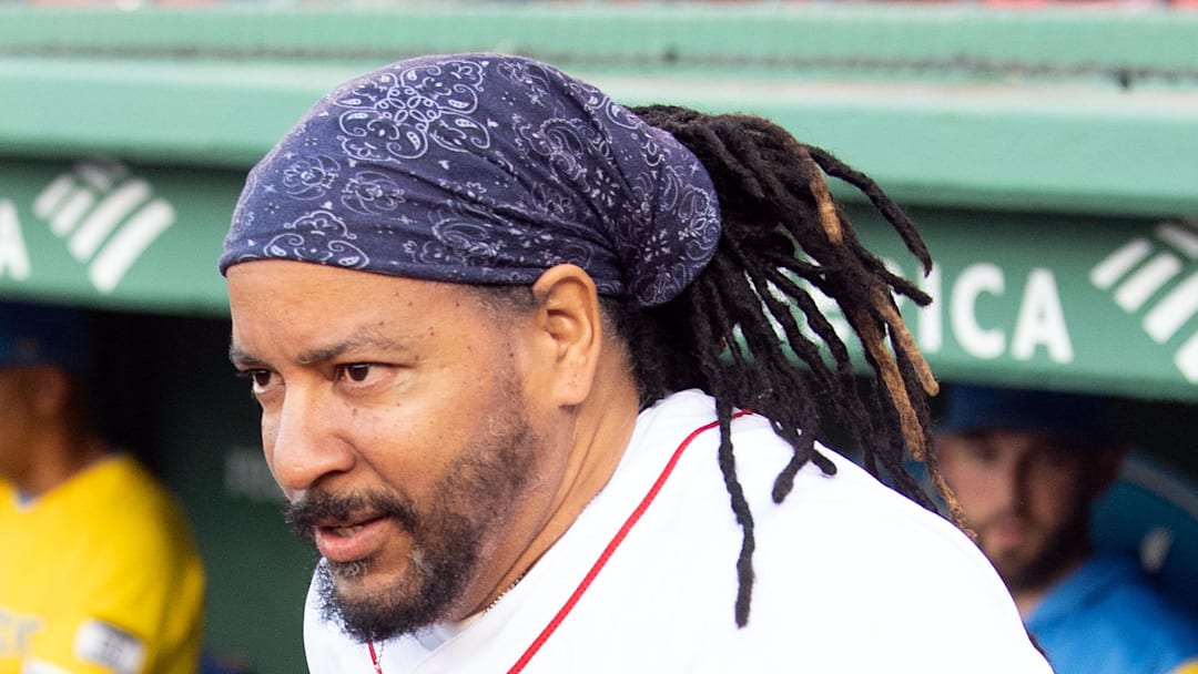 Former player Manny Ramirez runs onto the field as part of the Red Sox Hall of Fame induction before a game against the Detroit Tigers at Fenway Park on June 20, 2022. 
