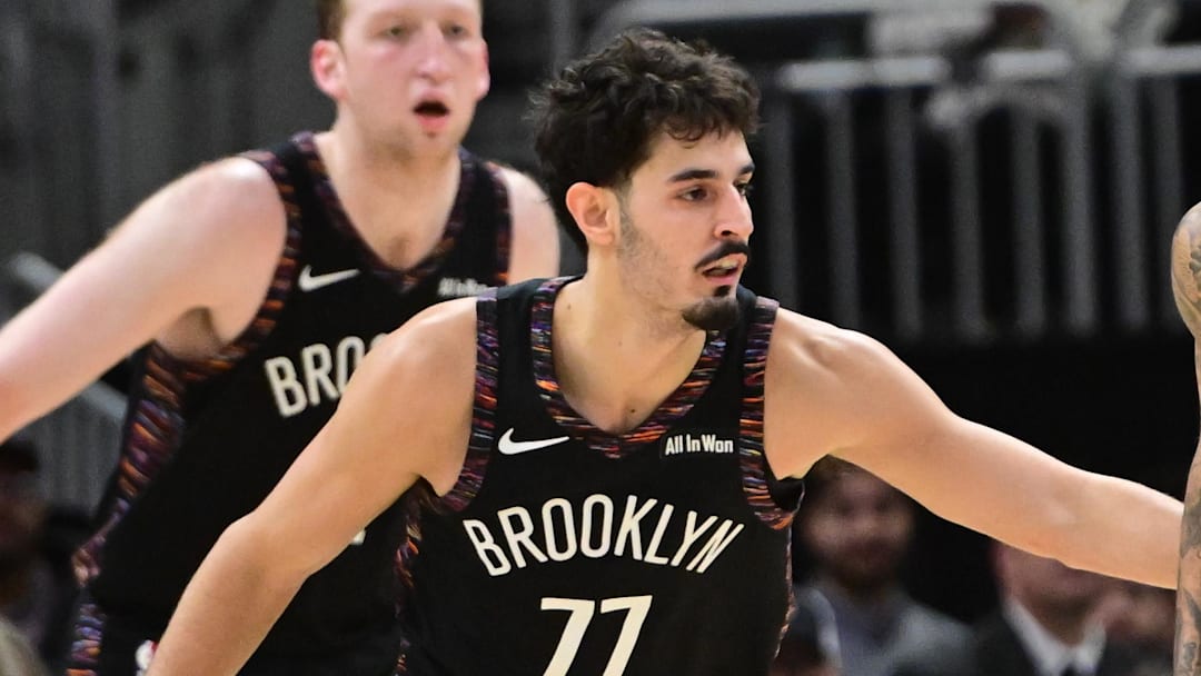 Nov 29, 2025; Milwaukee, Wisconsin, USA;  Milwaukee Bucks forward Kyle Kuzma (18) looks for a shot against Brooklyn Nets guard Ben Saraf (77) in the third quarter at Fiserv Forum. Mandatory Credit: Benny Sieu-Imagn Images