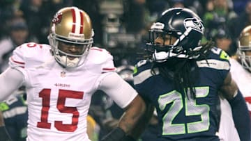 San Francisco 49ers wide receiver Michael Crabtree (L) and Seattle Seahawks cornerback Richard Sherman (R)