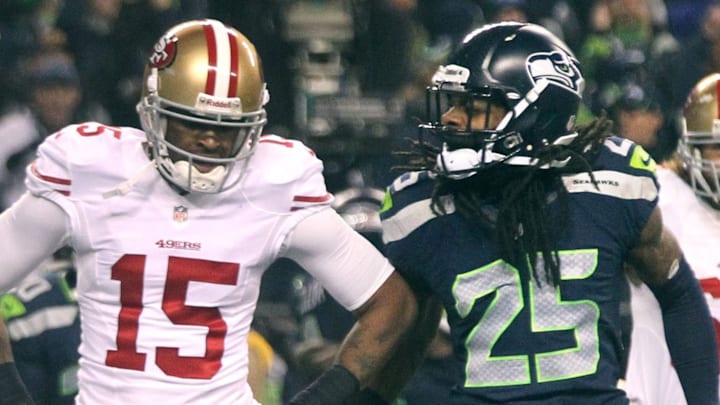 San Francisco 49ers wide receiver Michael Crabtree (L) and Seattle Seahawks cornerback Richard Sherman (R)