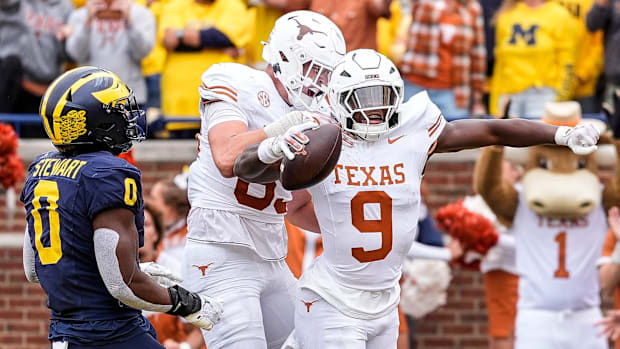exas running back Jerrick Gibson (9) celebrates a touchdown 