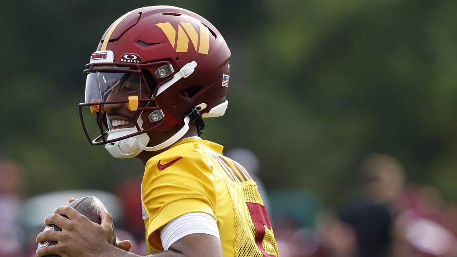 Jul 25, 2024; Ashburn, VA, USA; Washington Commanders quarterback Jayden Daniels (5) prepares to pass the ball during day two of Commanders training camp at OrthoVirginia Training Center at Commanders Park. Mandatory Credit: Geoff Burke-USA TODAY Sports | Geoff Burke-USA TODAY Sports