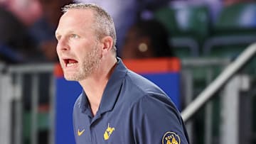 Nov 29, 2024; Paradise Island, Bahamas, BHS;  West Virginia Mountaineers head coach Darian DeVries reacts against the Arizona Wildcats during the first half at Imperial Arena at the Atlantis resort.  Mandatory Credit: Kevin Jairaj-Imagn Images