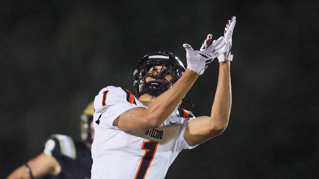Oviedo Jordan Donahoo (1) tries to catch the pass under pressure from Oviedo Bruce Slivinski (5) during the 2025 FHSAA Football 6A quarter final at Citizens Field in Gainesville, FL on Thursday, November 13, 2025. [Alan Youngblood/Gainesville Sun]