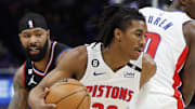 Dec 26, 2022; Detroit, Michigan, USA;  Detroit Pistons guard Jaden Ivey (23) dribbles on LA Clippers forward Marcus Morris Sr. (8) in the first half at Little Caesars Arena. Mandatory Credit: Rick Osentoski-Imagn Images