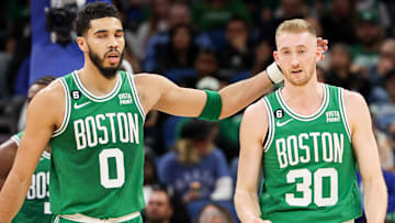 Boston Celtics forward Jayson Tatum (0) and forward Sam Hauser (30) react after a play against the Orlando Magic in the second quarter at Amway Center.