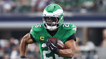 Nov 23, 2025; Arlington, Texas, USA; Philadelphia Eagles running back Saquon Barkley (26) runs with the ball in the first quarter against the Dallas Cowboys at AT&T Stadium. 