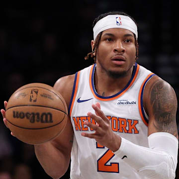 Apr 13, 2025; Brooklyn, New York, USA;  New York Knicks guard Miles McBride (2) dribbles up court during the first half against the Brooklyn Nets at Barclays Center. Mandatory Credit: Vincent Carchietta-Imagn Images