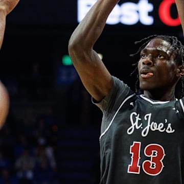Nov 20, 2023; Lexington, Kentucky, USA; Saint Joseph's Hawks forward Rasheer Fleming (13) shoots the ball during the first half against the Kentucky Wildcats at Rupp Arena at Central Bank Center. Mandatory Credit: Jordan Prather-Imagn Images