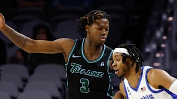 Mar 15, 2025; Fort Worth, TX, USA; Memphis Tigers guard Colby Rogers (3) controls the ball as Tulane Green Wave guard Kam Williams (3) defends during the first half at Dickies Arena. Mandatory Credit: Chris Jones-Imagn Images