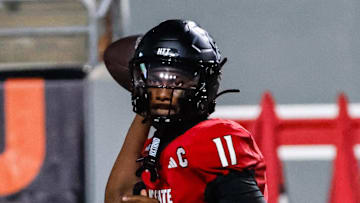Sep 27, 2025; Raleigh, North Carolina, USA; North Carolina State Wolfpack quarterback CJ Bailey (11) throws the football during the first half of the game against Virginia Tech Hokies at Carter-Finley Stadium. Mandatory Credit: Jaylynn Nash-Imagn Images