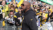 Sep 28, 2025; Dublin, Ireland; Pittsburgh Steelers coach Mike Tomlin interacts with fans during an NFL International Series game against the Minnesota Vikings at Croke Park. 