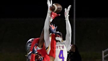 Pike Road's James Caver (2) helps break up a pass intended for Booker T. Washington's Marquez Daniel (4)during their game in Pike Road , Ala., on Friday November 3, 2023.