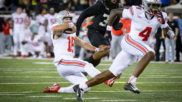 Ohio State Buckeyes quarterback Will Howard slides as time expires. TheNo. 3 Oregon Ducks beat the No. 2 Ohio State Buckeyes