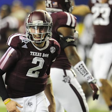 Dec 31, 2013; Atlanta, GA, USA;  Texas A&M Aggies quarterback Johnny Manziel (2) smiles after a comeback win over the Duke Blue Devils 52-48 in the 2013 Chick-fil-a Bowl at the Georgia Dome. Mandatory Credit: Dale Zanine-Imagn Images