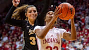 Indiana's Chloe Moore-McNeil (22) scoreas past Prudue's Sophie Swanson (31) during the Indiana versus Purdue women's basketball game at Simon Skjodt Assembly Hall on Saturday, Feb. 15, 2025.