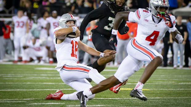 Ohio State Buckeyes quarterback Will Howard slides as time expires agains the No. 3 Oregon Ducks.