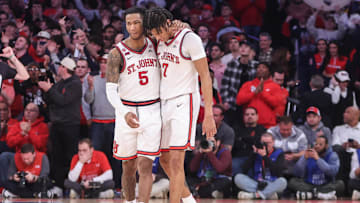 Feb 23, 2025; New York, New York, USA;  St. John's basketball guards Deivon Smith (5) and Simeon Wilcher (7) walk off the court in the closing seconds of the second half against the Connecticut Huskies at Madison Square Garden.