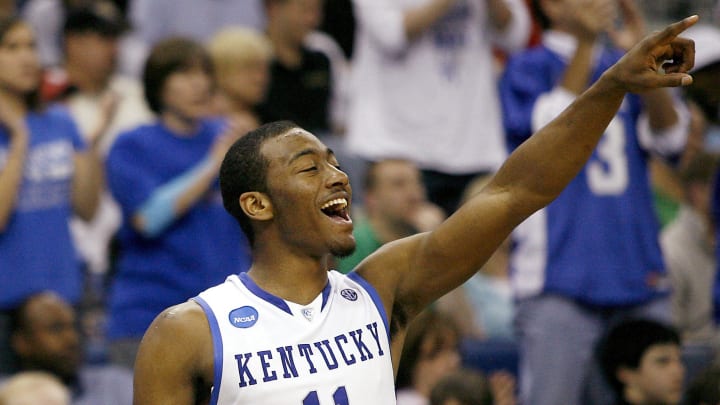 Mar 20, 2010; New Orleans, LA, USA; Kentucky Wildcats guard John Wall (11) celebrates a basket by a teammate against the Wake Forest Demon Deacons during the second half in the second round of the 2010 NCAA mens basketball tournament at the New Orleans Arena. Kentucky defeated Wake Forest 90-60. Mandatory Credit: Crystal LoGiudice-USA TODAY Sports