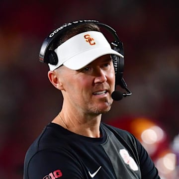 Sep 20, 2025; Los Angeles, California, USA; Southern California Trojans head coach Lincoln Riley speaks with the official during the second half at the Los Angeles Memorial Coliseum. Mandatory Credit: Gary A. Vasquez-Imagn Images