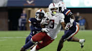 Sep 20, 2025; Charlottesville, Virginia, USA; Stanford Cardinal wide receiver C.J. Williams (3) catches a pass in front of Virginia Cavaliers cornerback Emmanuel Karnley (19) and Cavaliers linebacker Kam Robinson (5) during the fourth quarter at Scott Stadium. Mandatory Credit: Geoff Burke-Imagn Images