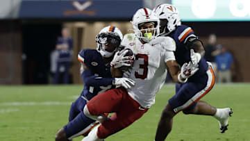 Sep 20, 2025; Charlottesville, Virginia, USA; Stanford Cardinal wide receiver C.J. Williams (3) catches a pass in front of Virginia Cavaliers cornerback Emmanuel Karnley (19) and Cavaliers linebacker Kam Robinson (5) during the fourth quarter at Scott Stadium. Mandatory Credit: Geoff Burke-Imagn Images